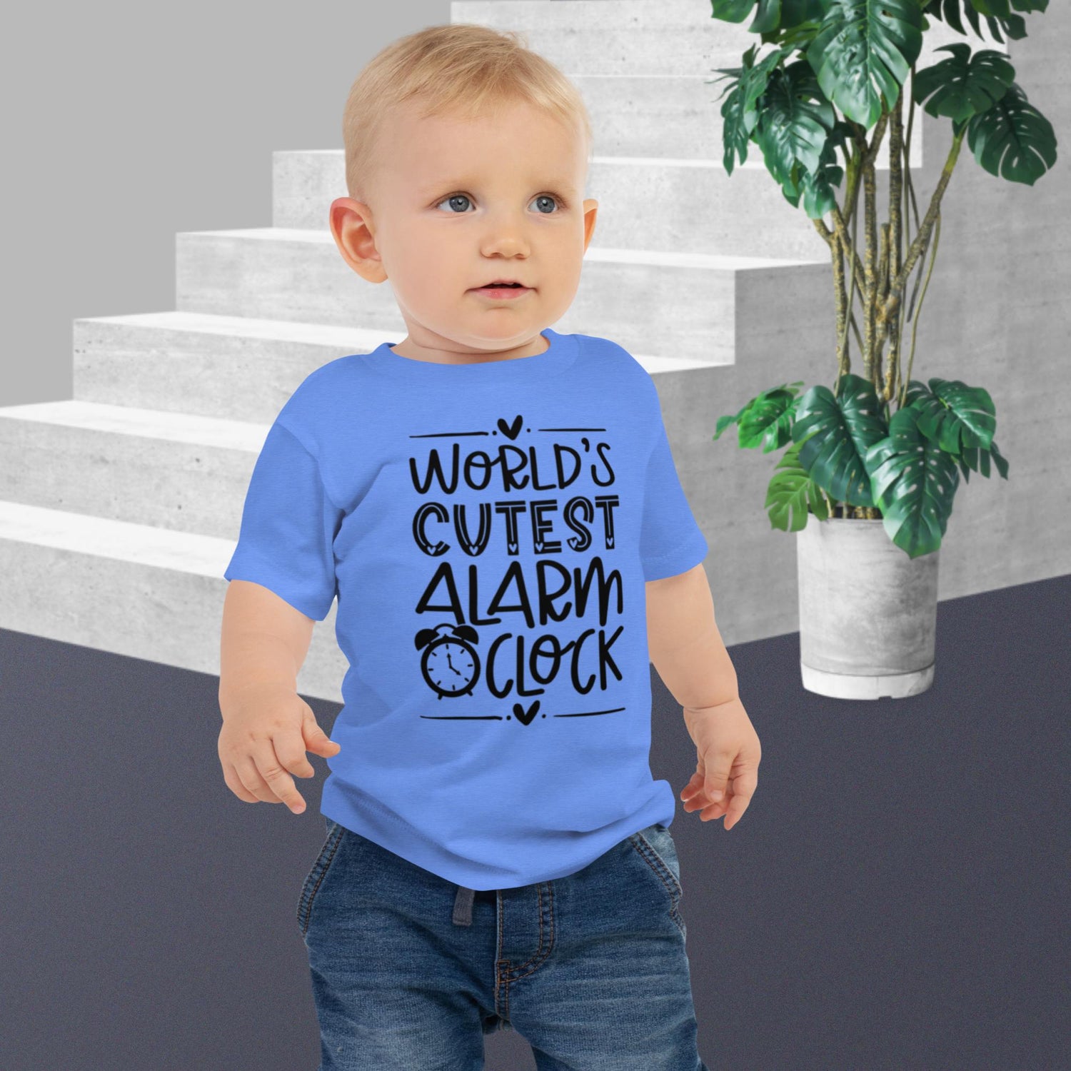 Blue baby jersey short sleeve tee featuring the words 'World's Cutest Alarm Clock' in bold black writing.