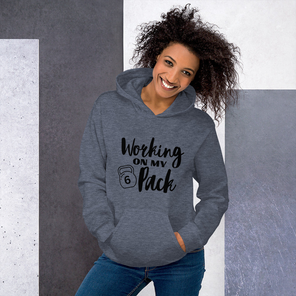 Heather sport dark navy colored unisex hoodie featuring the phrase 'Working on my 6 Pack' in black font. This cozy hoodie is perfect for the gym or evening walks.