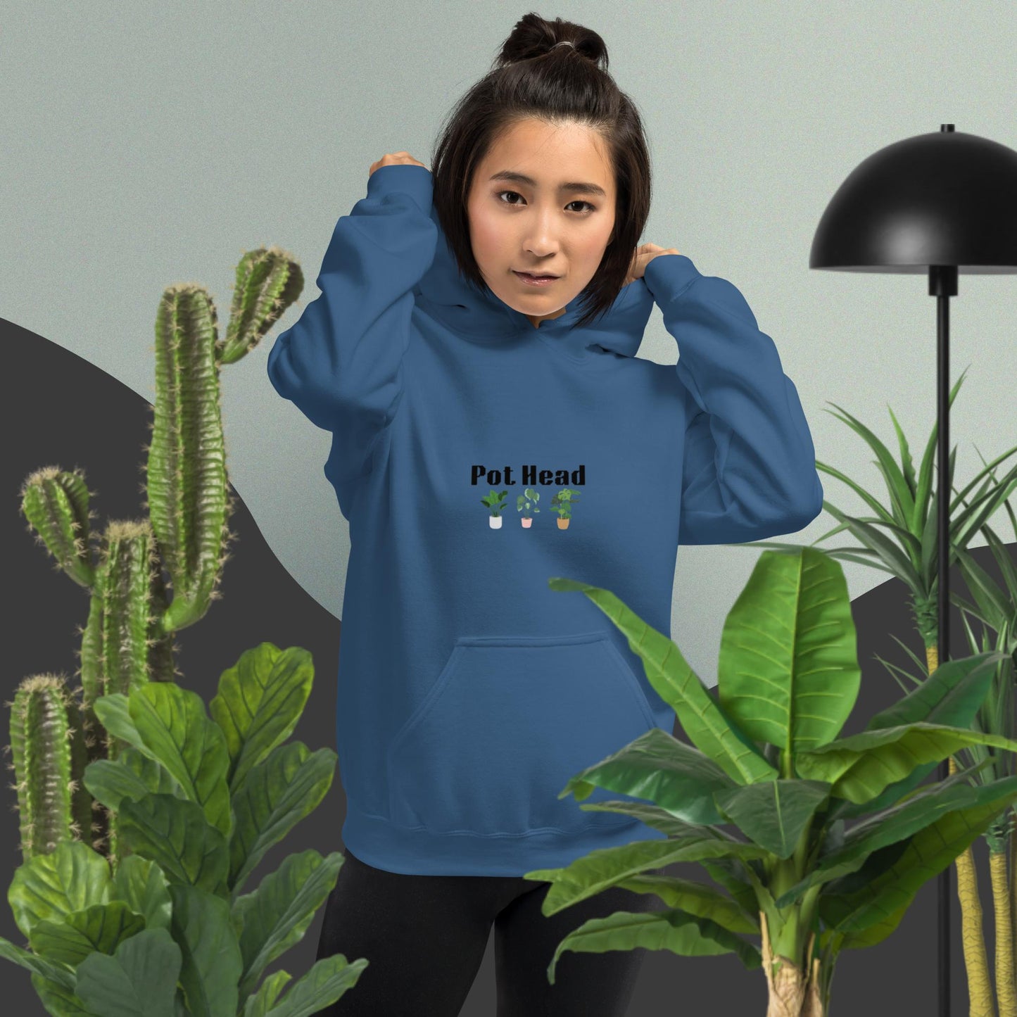 Indigo blue colored hoodie designed for plant lovers, featuring the phrase 'Pot Head' in bold black text above the front pouch pocket, complemented by a decorative plant design