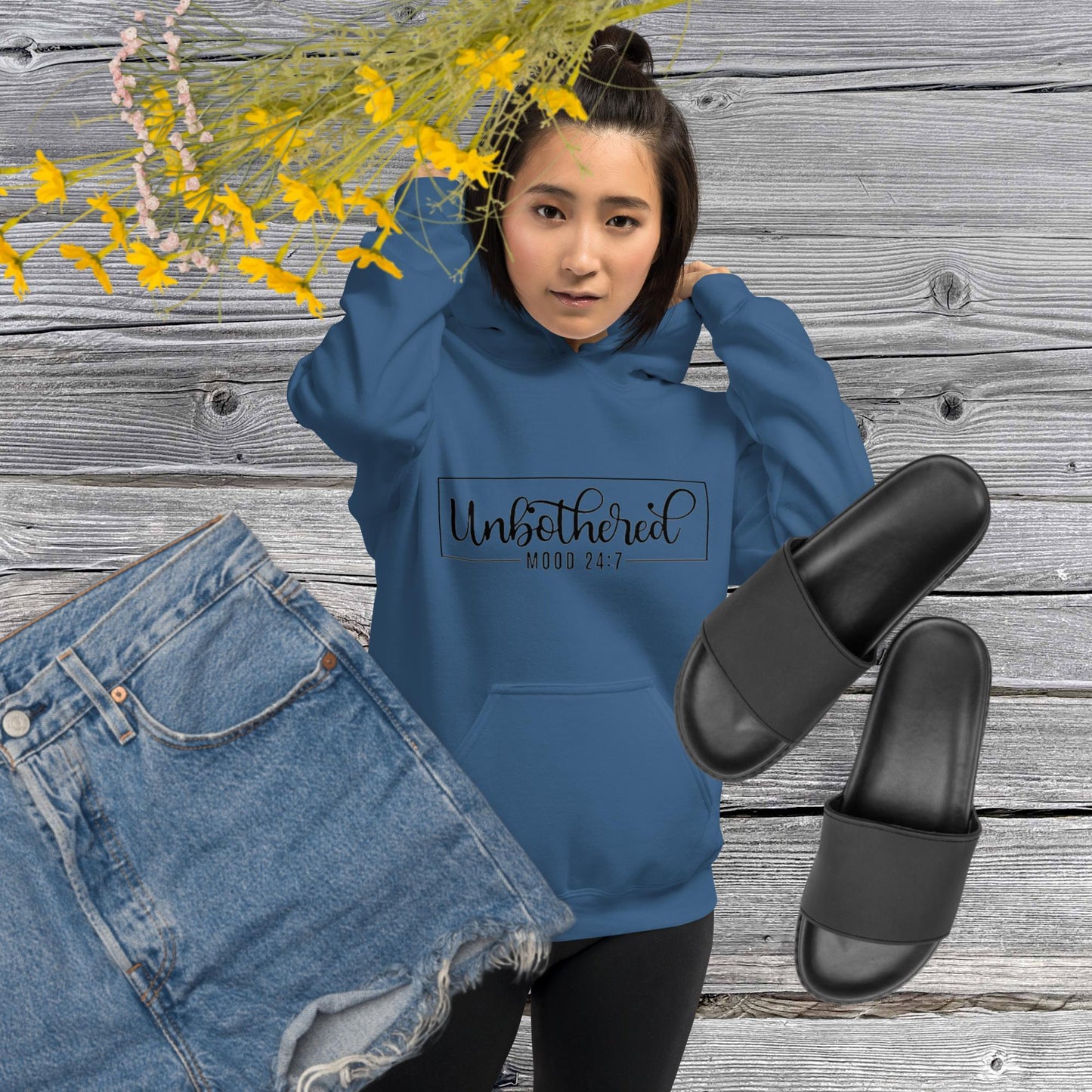 Indigo blue colored unisex hoodie featuring the word 'Unbothered,' serving as a reminder not to stress over things outside of your control.