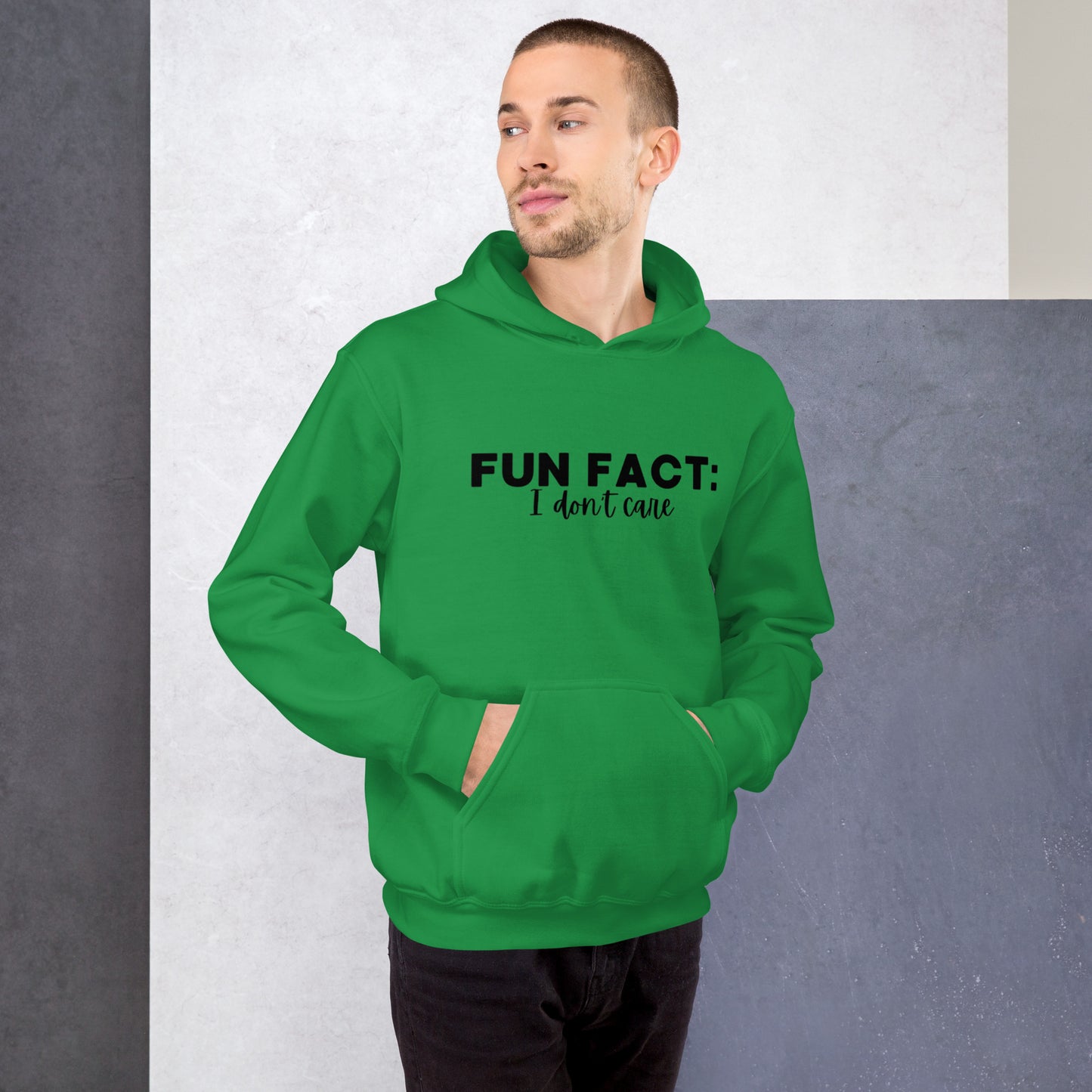 Irish green colored unisex hoodie featuring the phrase 'Fun Fact: I Don't Care' in bold black writing on the front above the front pouch pocket