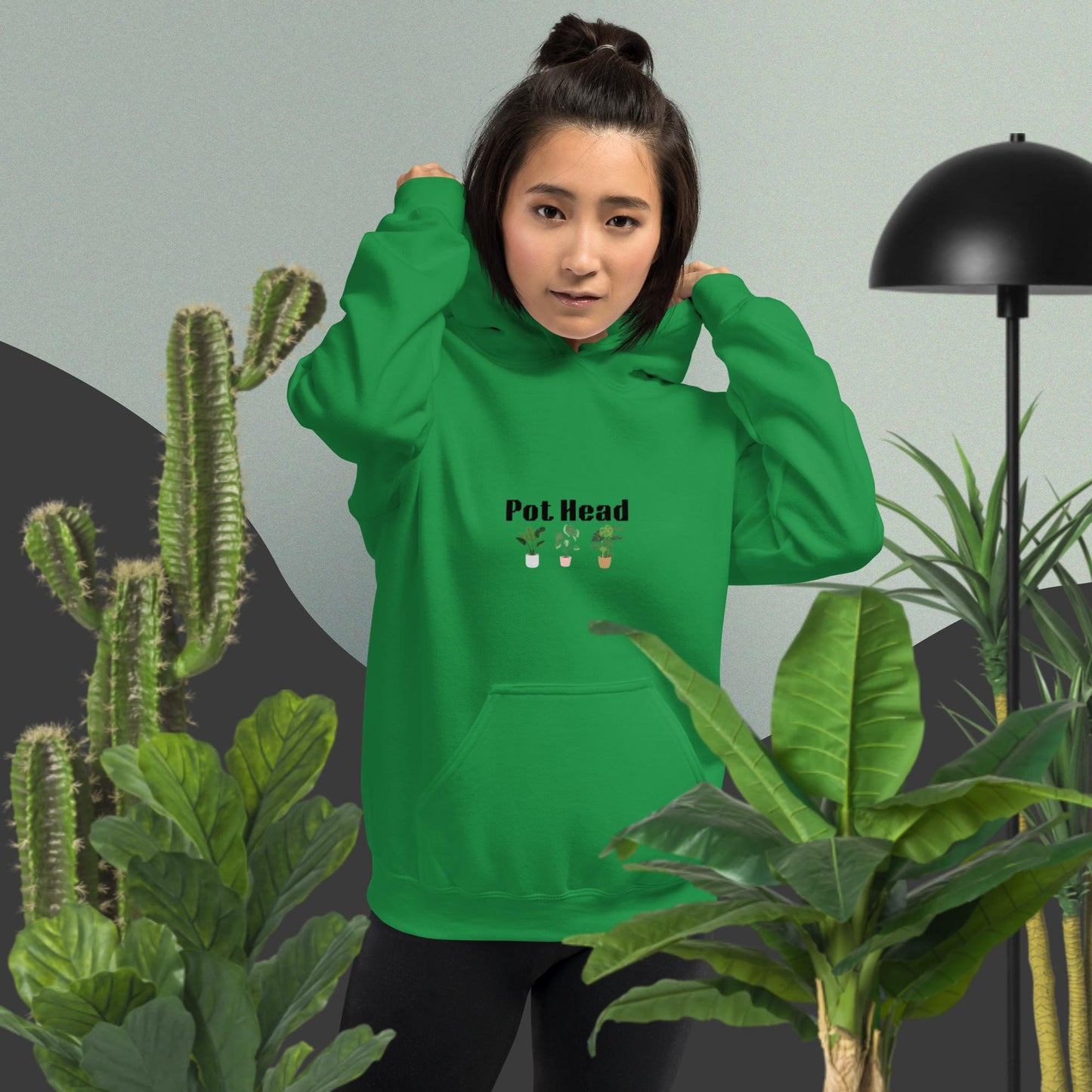 Irish green colored hoodie designed for plant lovers, featuring the phrase 'Pot Head' in bold black text above the front pouch pocket, complemented by a decorative plant design