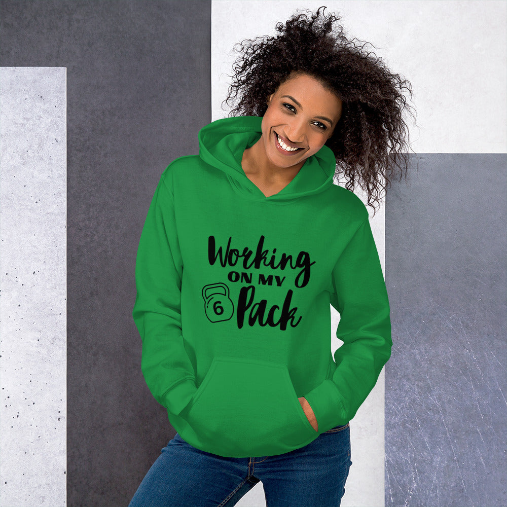 Irish green colored unisex hoodie featuring the phrase 'Working on my 6 Pack' in black font. This cozy hoodie is perfect for the gym or evening walks.