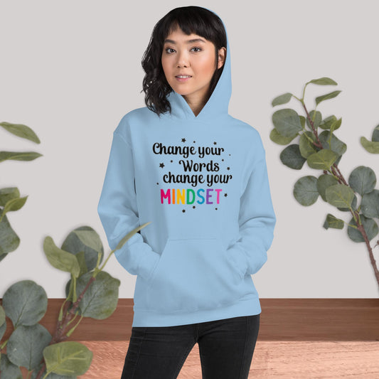 Light blue cozy unisex hoodie with a front pouch pocket, featuring the phrase 'Change Your Words Change Your Mindset' in bold black writing on the front, perfect for cooler evenings.