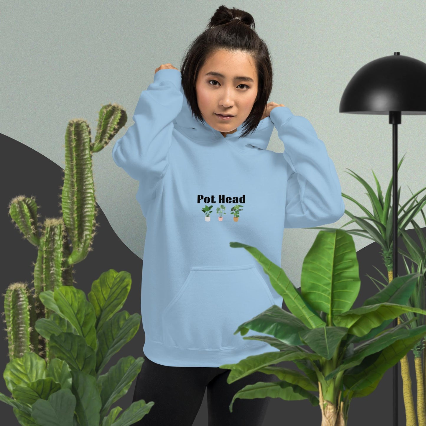 Light blue colored hoodie designed for plant lovers, featuring the phrase 'Pot Head' in bold black text above the front pouch pocket, complemented by a decorative plant design