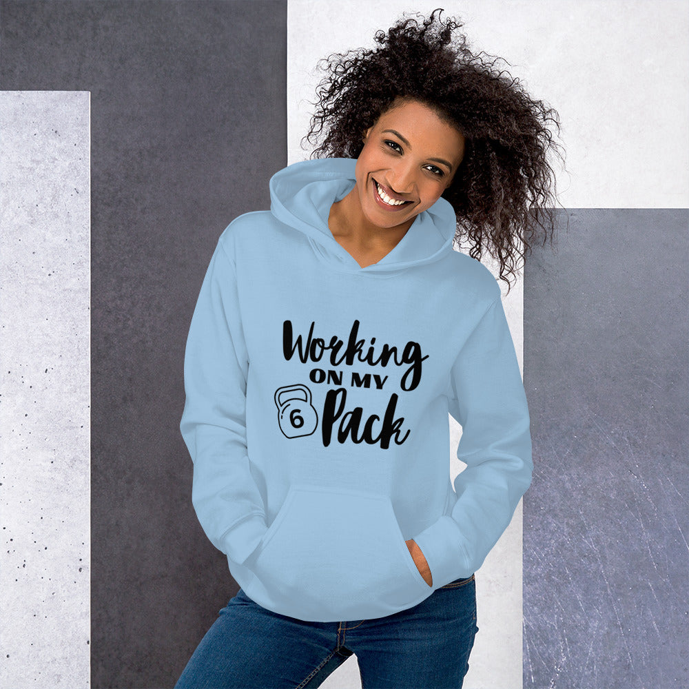 Light blue colored unisex hoodie featuring the phrase 'Working on my 6 Pack' in black font. This cozy hoodie is perfect for the gym or evening walks.