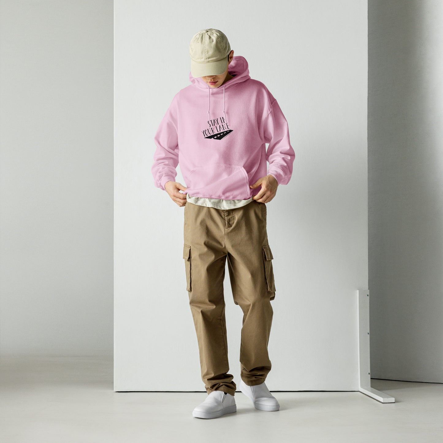 Light pink colored hoodie featuring the phrase 'Stay in Your Lane,' serving as a reminder to focus on yourself and your goals