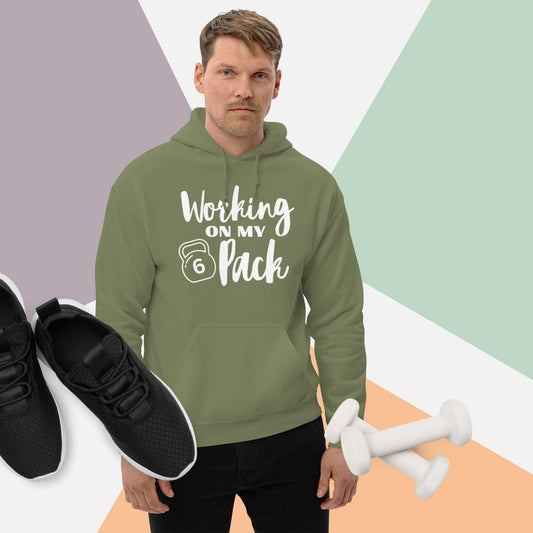 Military green colored unisex hoodie featuring the phrase 'Working on my 6 Pack' in white font. This cozy hoodie is perfect for the gym or evening walks.