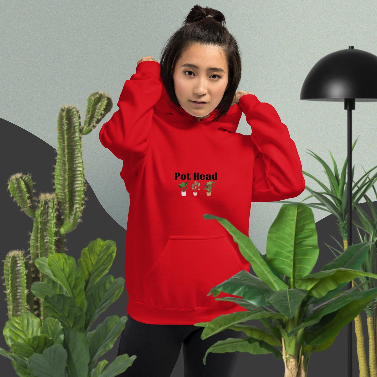 Red hoodie designed for plant lovers, featuring the phrase 'Pot Head' in bold black text above the front pouch pocket, complemented by a decorative plant design