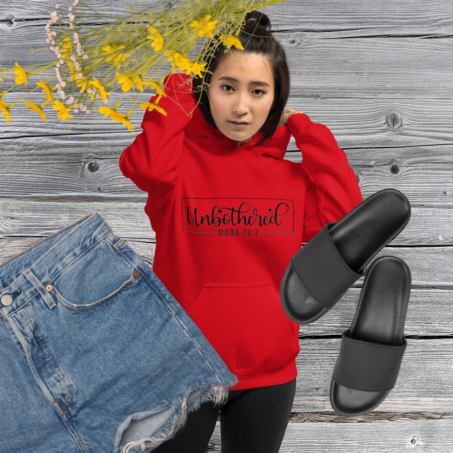 Red unisex hoodie featuring the word 'Unbothered,' serving as a reminder not to stress over things outside of your control.