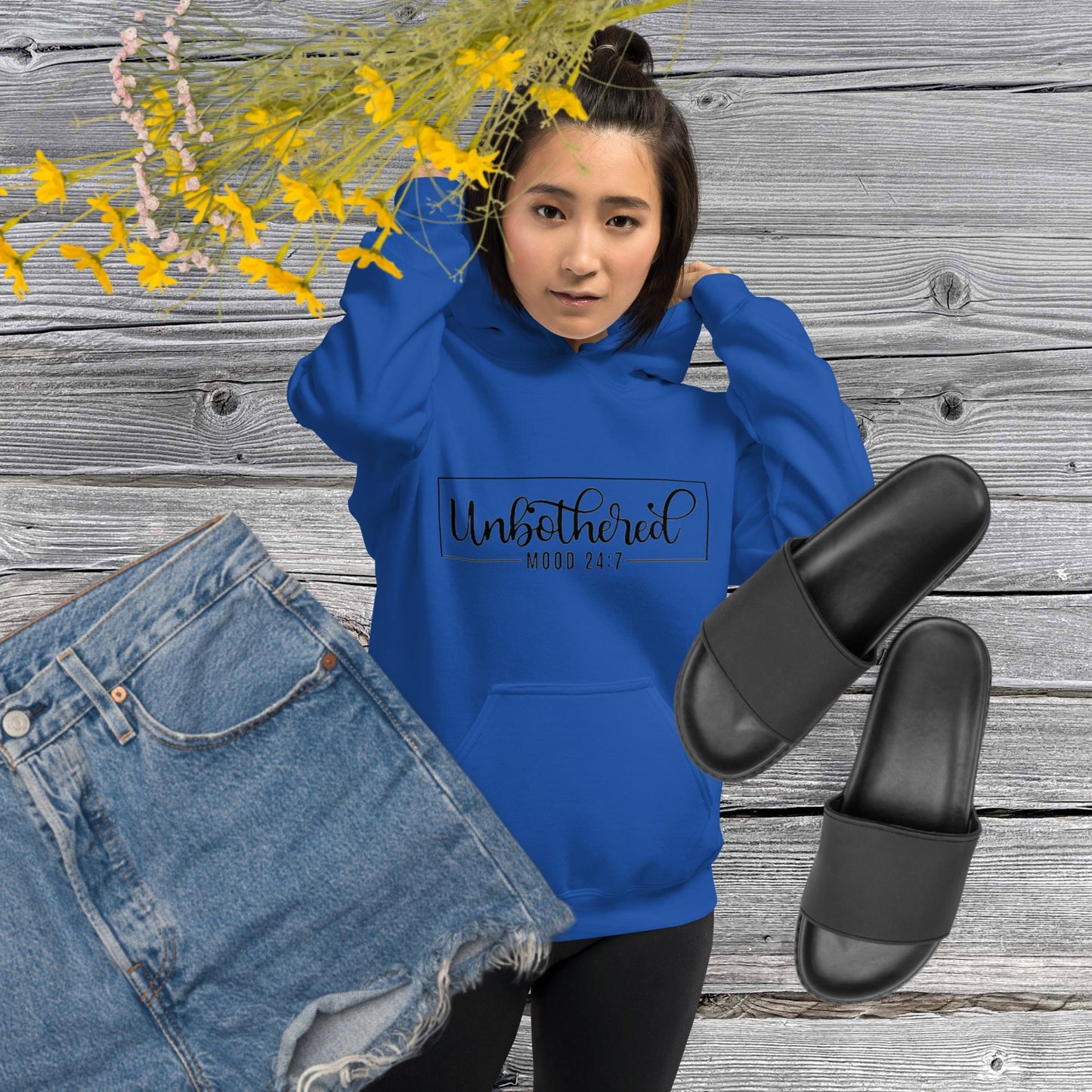 Royal colored unisex hoodie featuring the word 'Unbothered,' serving as a reminder not to stress over things outside of your control.