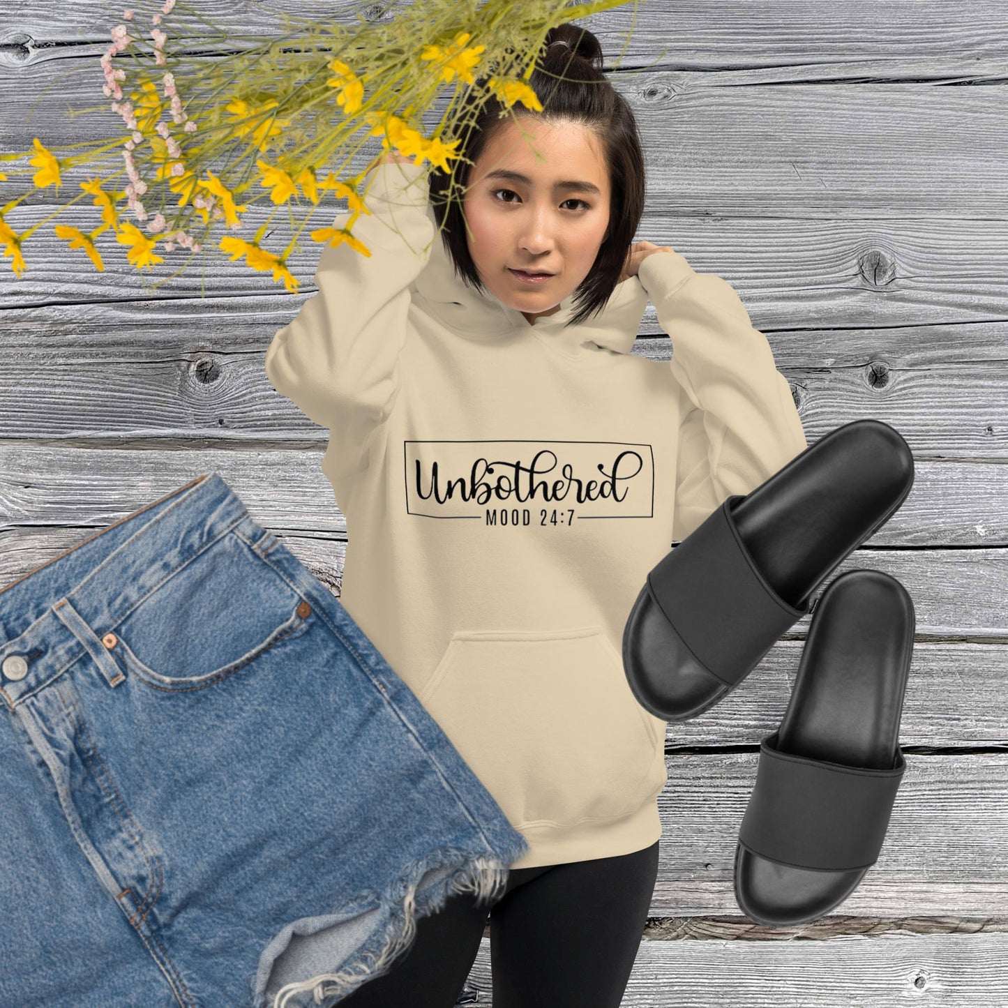 Sand colored unisex hoodie featuring the word 'Unbothered,' serving as a reminder not to stress over things outside of your control.