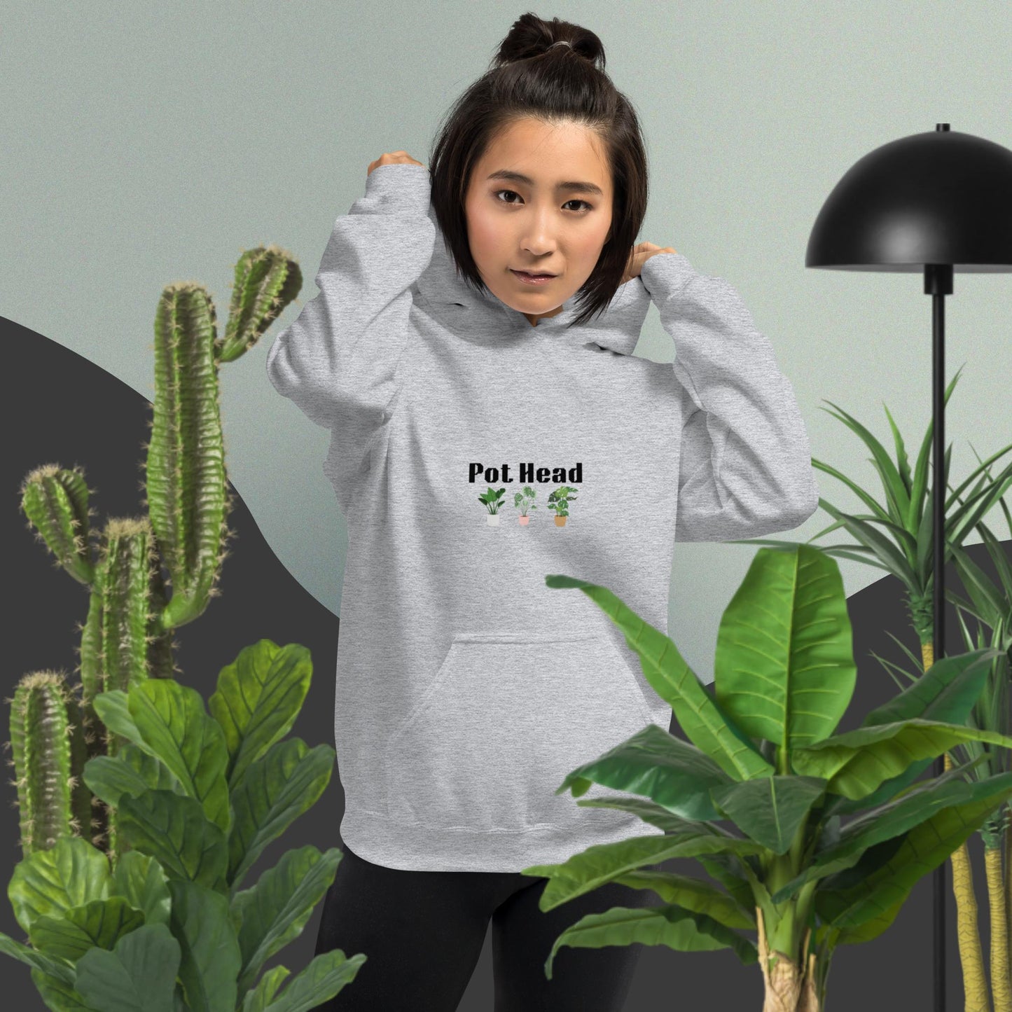 Sport grey colored hoodie designed for plant lovers, featuring the phrase 'Pot Head' in bold black text above the front pouch pocket, complemented by a decorative plant design