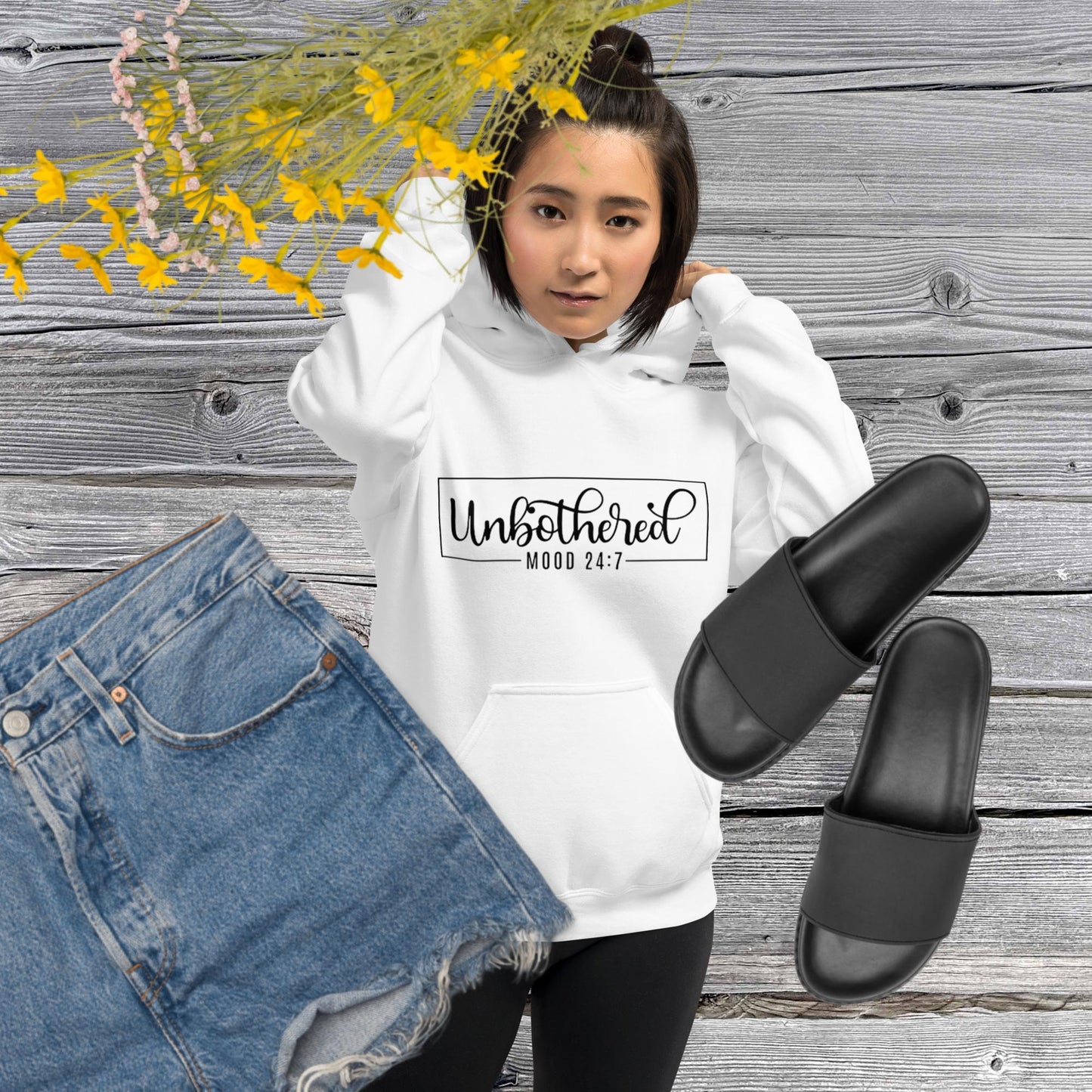 White unisex hoodie featuring the word 'Unbothered,' serving as a reminder not to stress over things outside of your control.